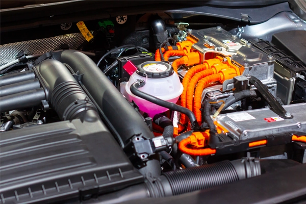 Close-up of a hybrid vehicle's engine and components.