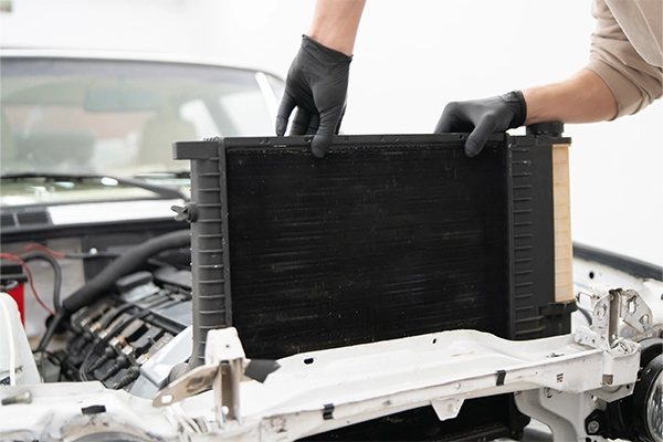 Car radiator being replaced