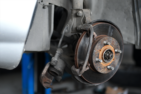 close-up image of a rusty brake caliper 